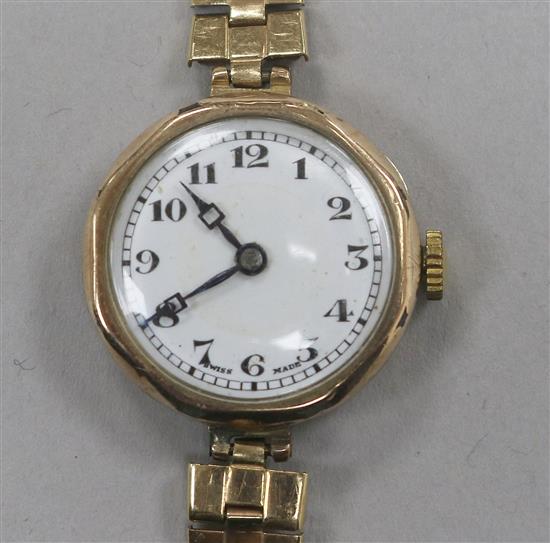 A ladys 9ct gold Rolex manual wind wrist watch, with engraved monogram, on later associated 9ct gold bracelet.